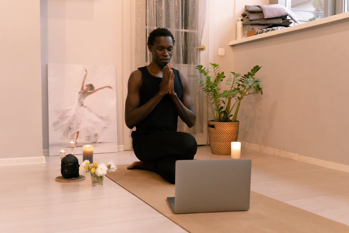 Man in Black Tank Top Doing Yoga